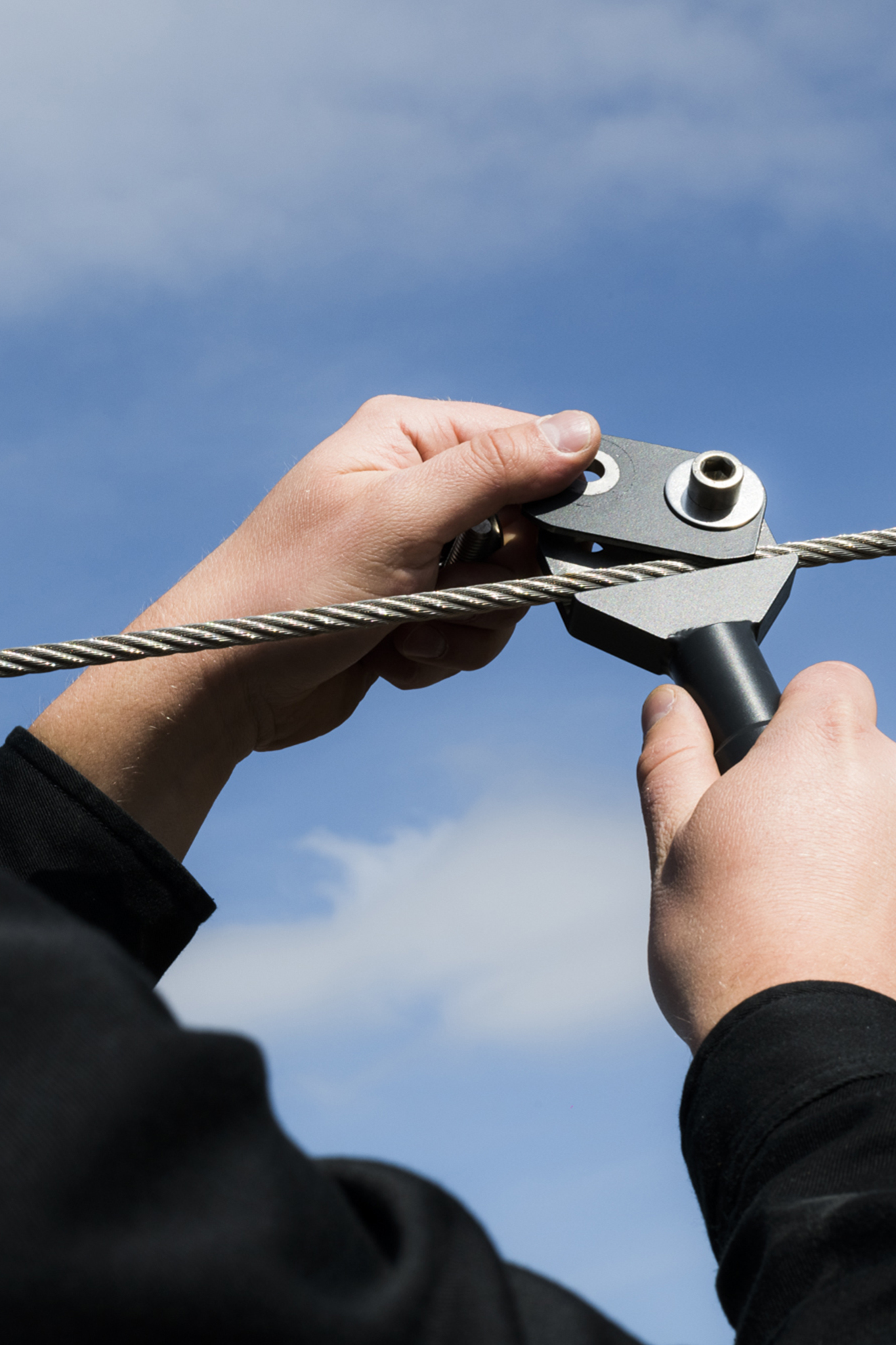 Close up of mounting a Sunseeker on its steel cable.