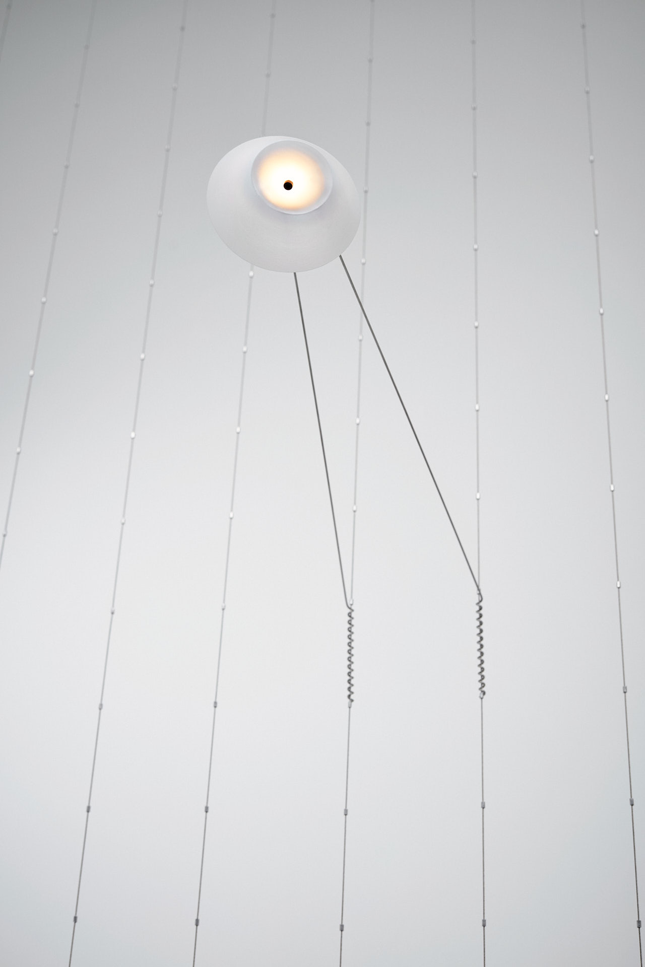 Single Liiu light element, lightweight minimalistic lampshade which seems to be floating.