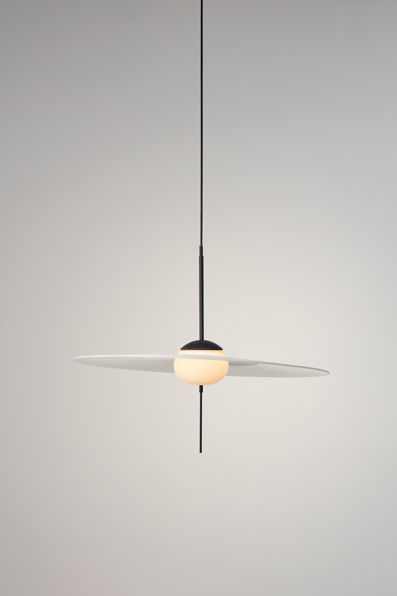 Mono by VANTOT, playful glass light resembling Saturn with it's rings.