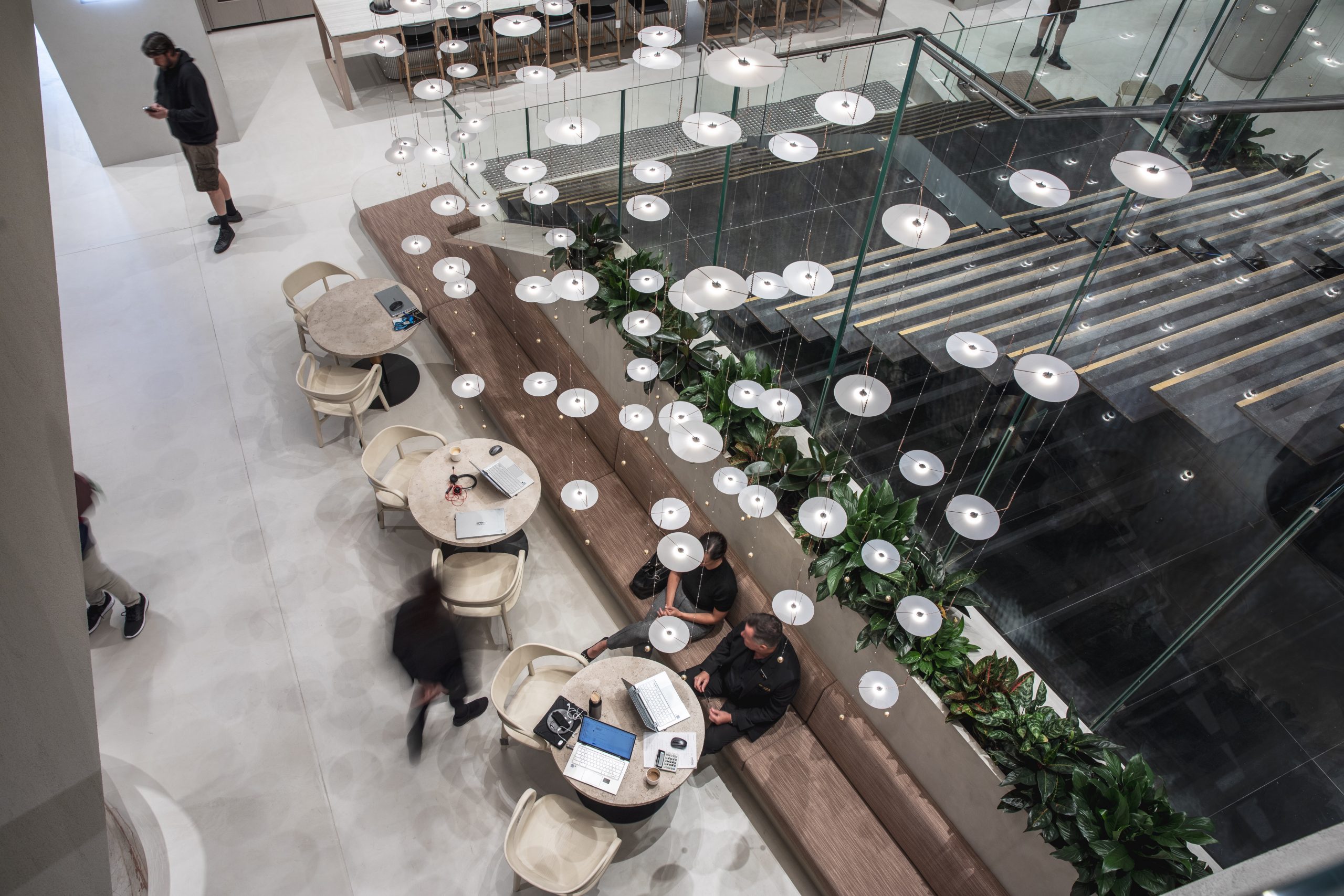 Vast array of suspended O-O-O lights about a seating area in a mall in Australia.