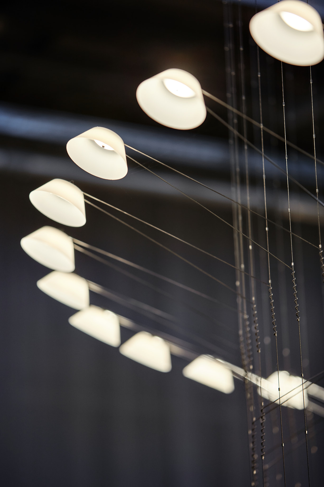 Detail photo of VANTOT's Liiu at Kazerne, Eindhoven. Flexible suspension lamp system, consisting of several led lights.