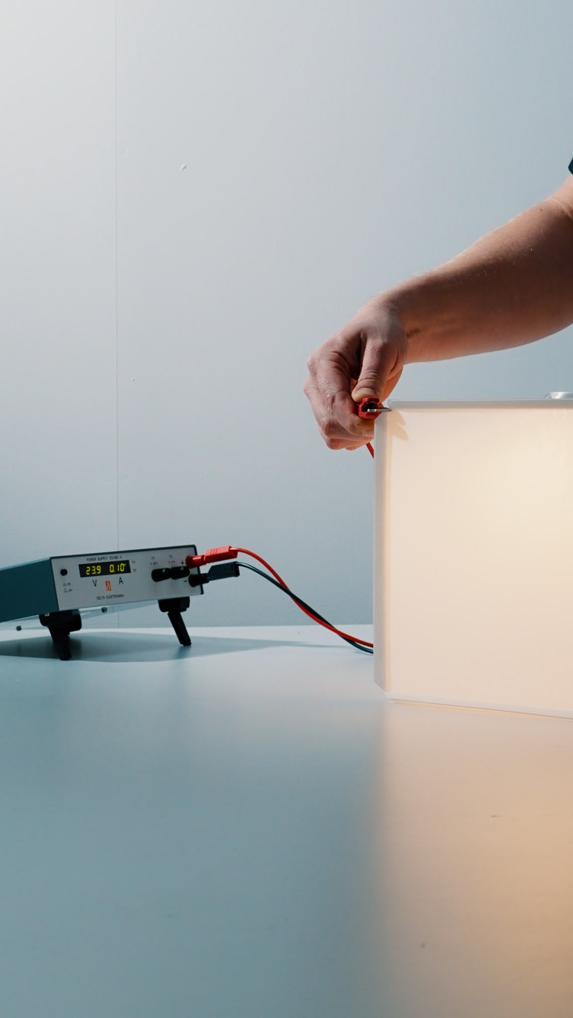 kubius VANTOT testing a custom-made KUBIUS chandelier prototype in the studio, exploring modular geometry, light quality and material details for the Living Lobby at World Trade Center Amsterdam.